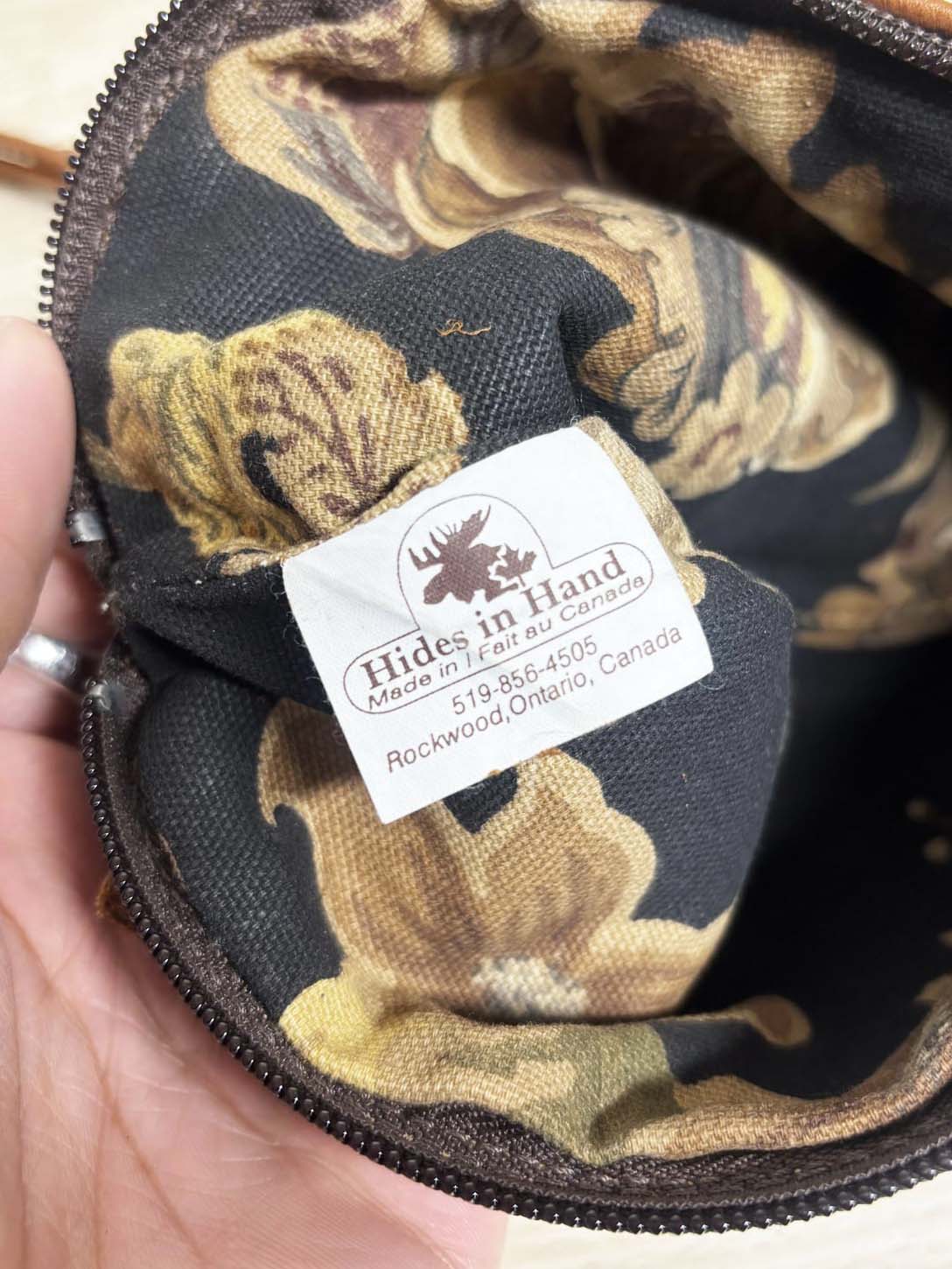 hides in hand fringe leather crossbody bag + tassel charm