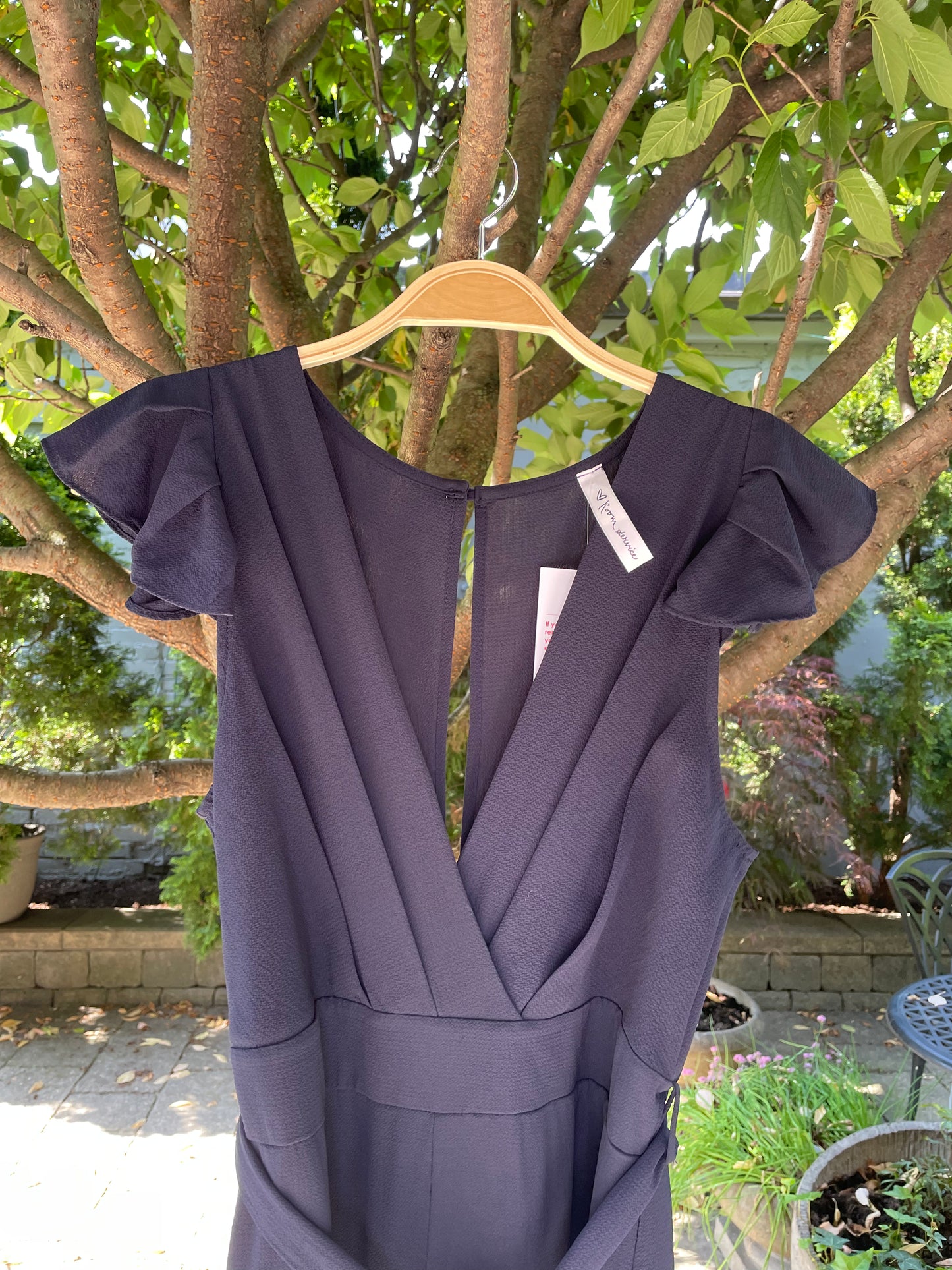 room service ruffle shoulder pleated belted jumpsuit