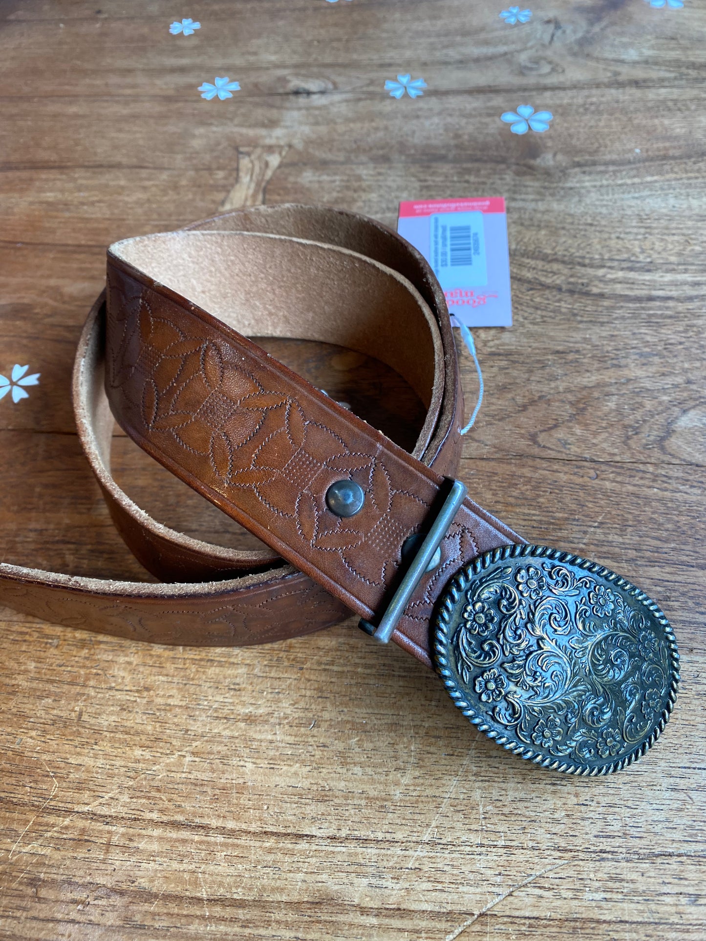 vintage tooled leather belt with brass buckle