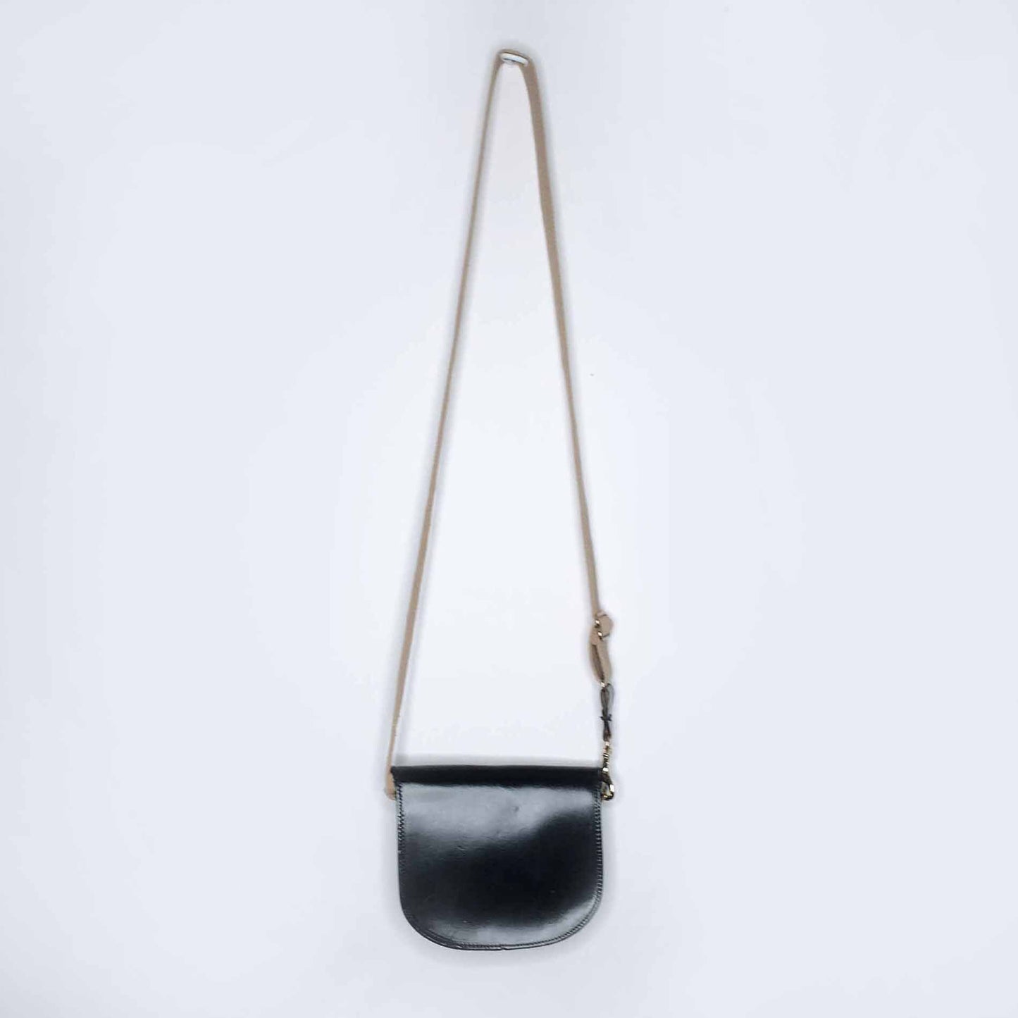 Mini leather saddle cross body bag with woven strap