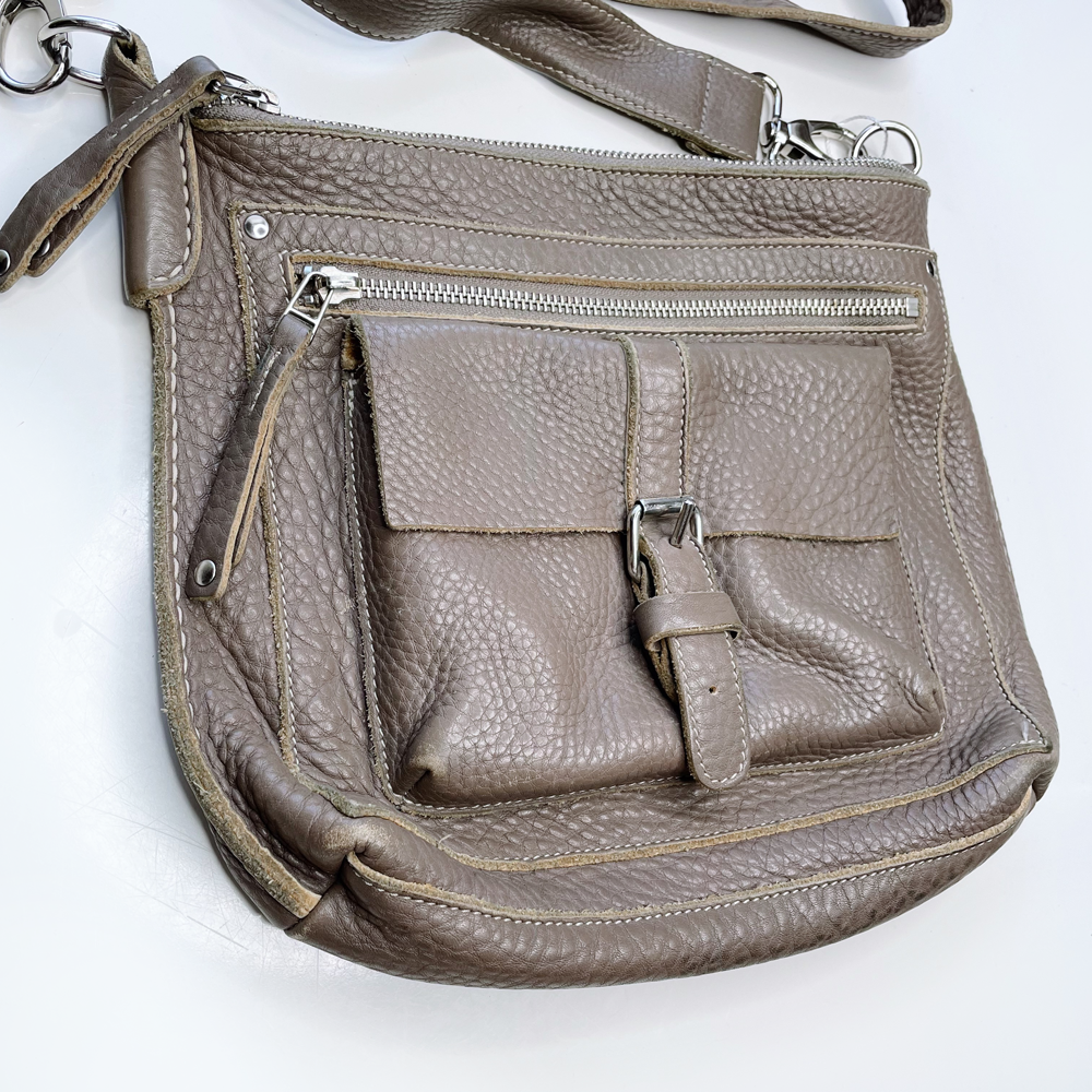 roots pebbled leather crossbody bag with front cargo pocket