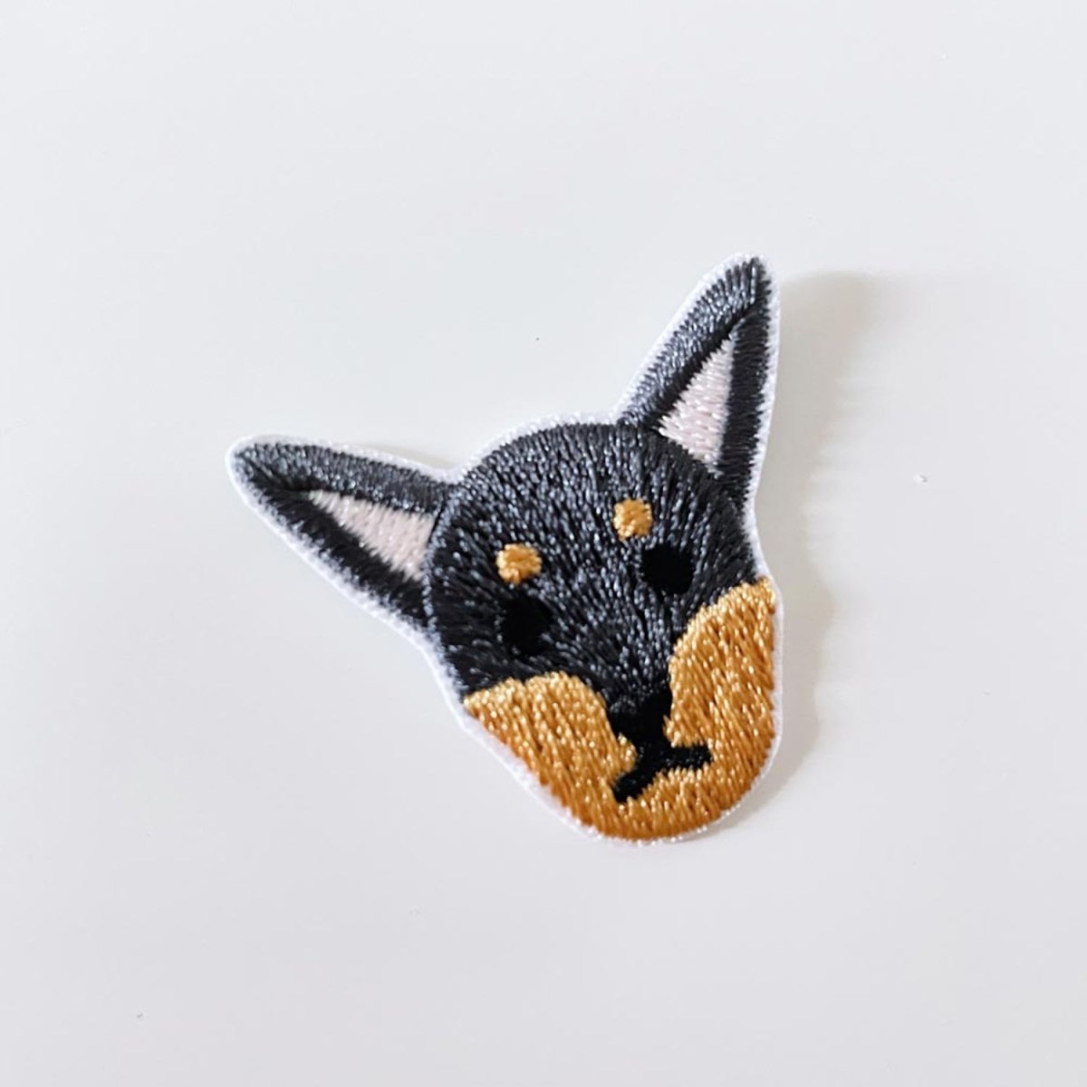 embroidered dog iron - on patch - good market thrift store