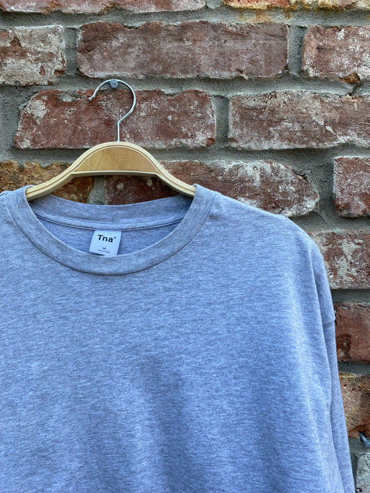 tna tour cropped long sleeve tee