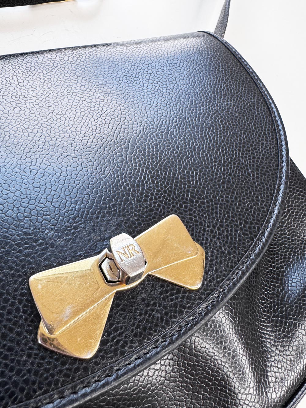 vintage nina ricci bow turn lock leather bag
