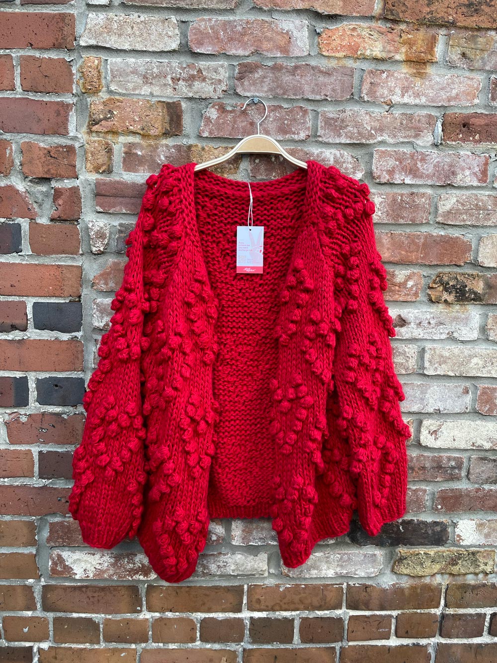 red chunky knit heart pom open cardigan