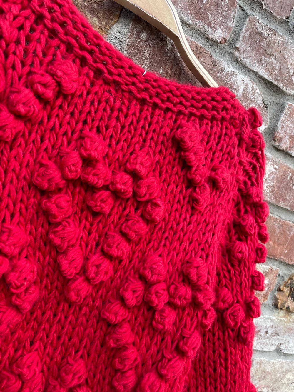 red chunky knit heart pom open cardigan