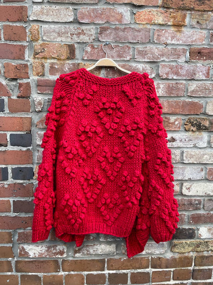 red chunky knit heart pom open cardigan