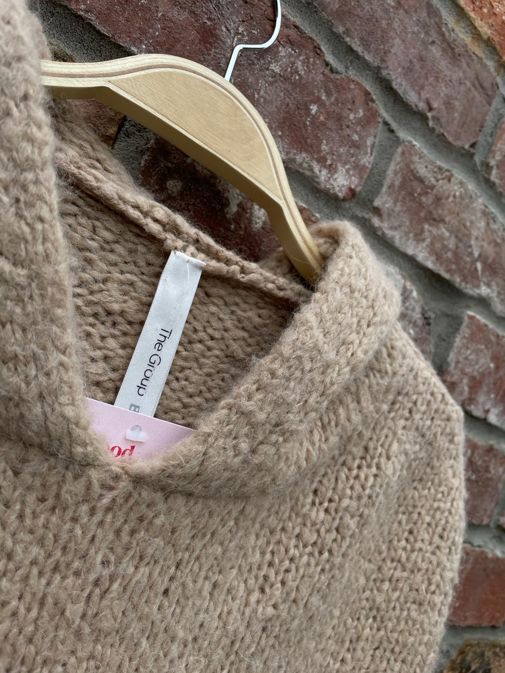 the group babaton alpaca wool hooded sweater