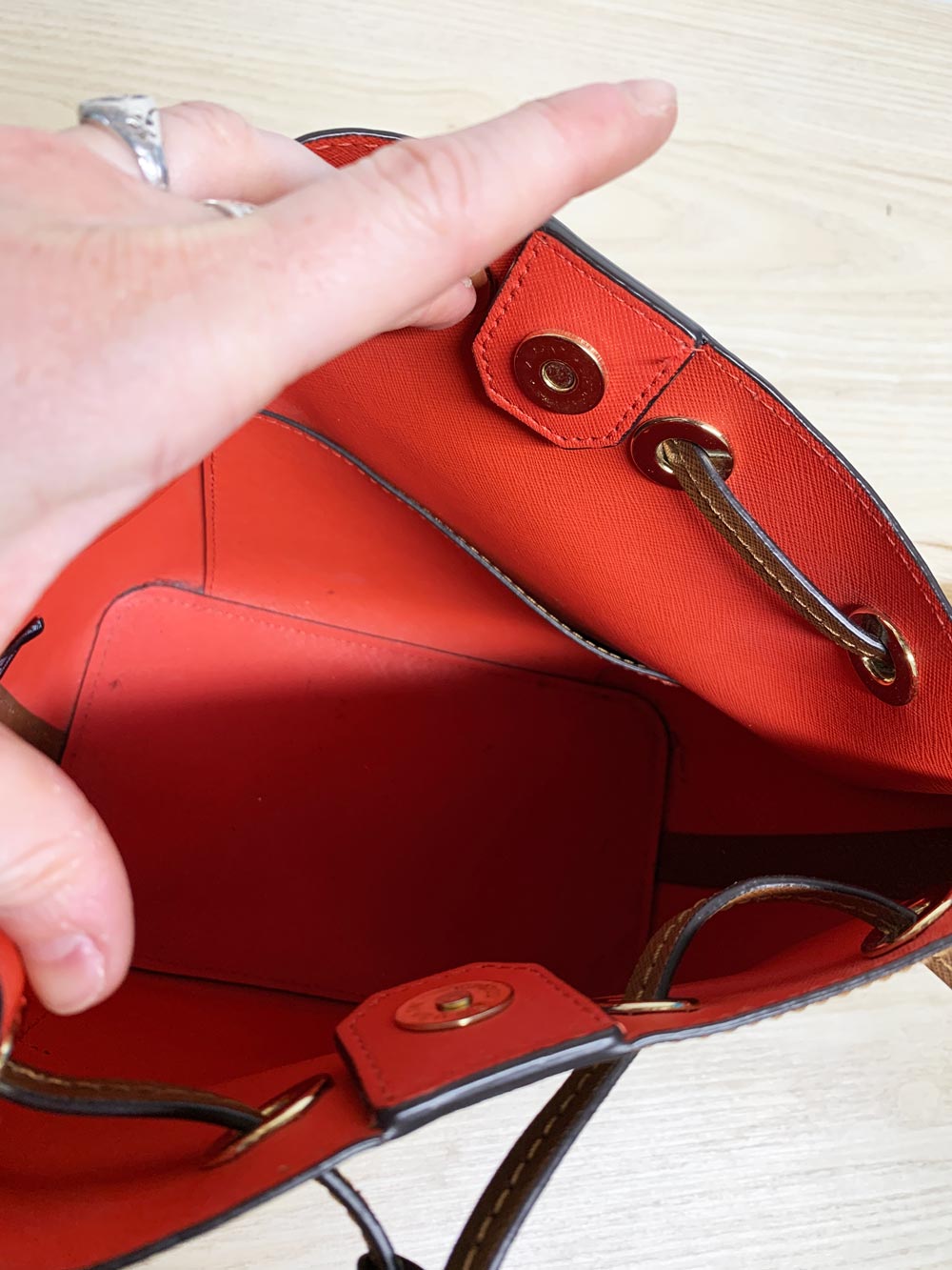 michael kors faux leather pom charm bucket bag