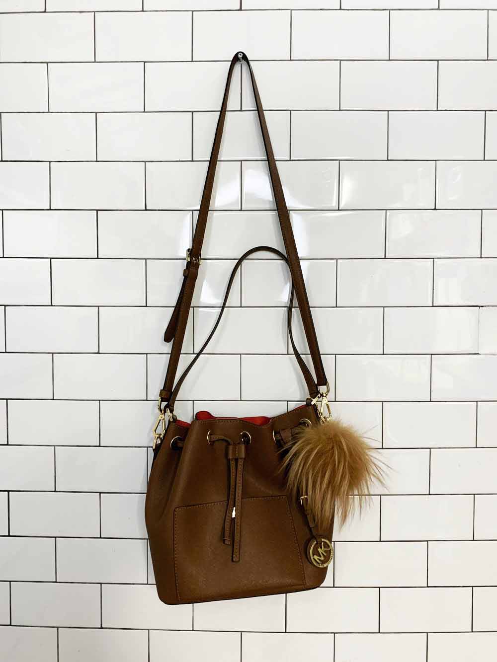 michael kors faux leather pom charm bucket bag