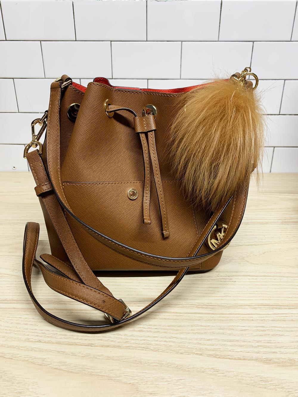 michael kors faux leather pom charm bucket bag