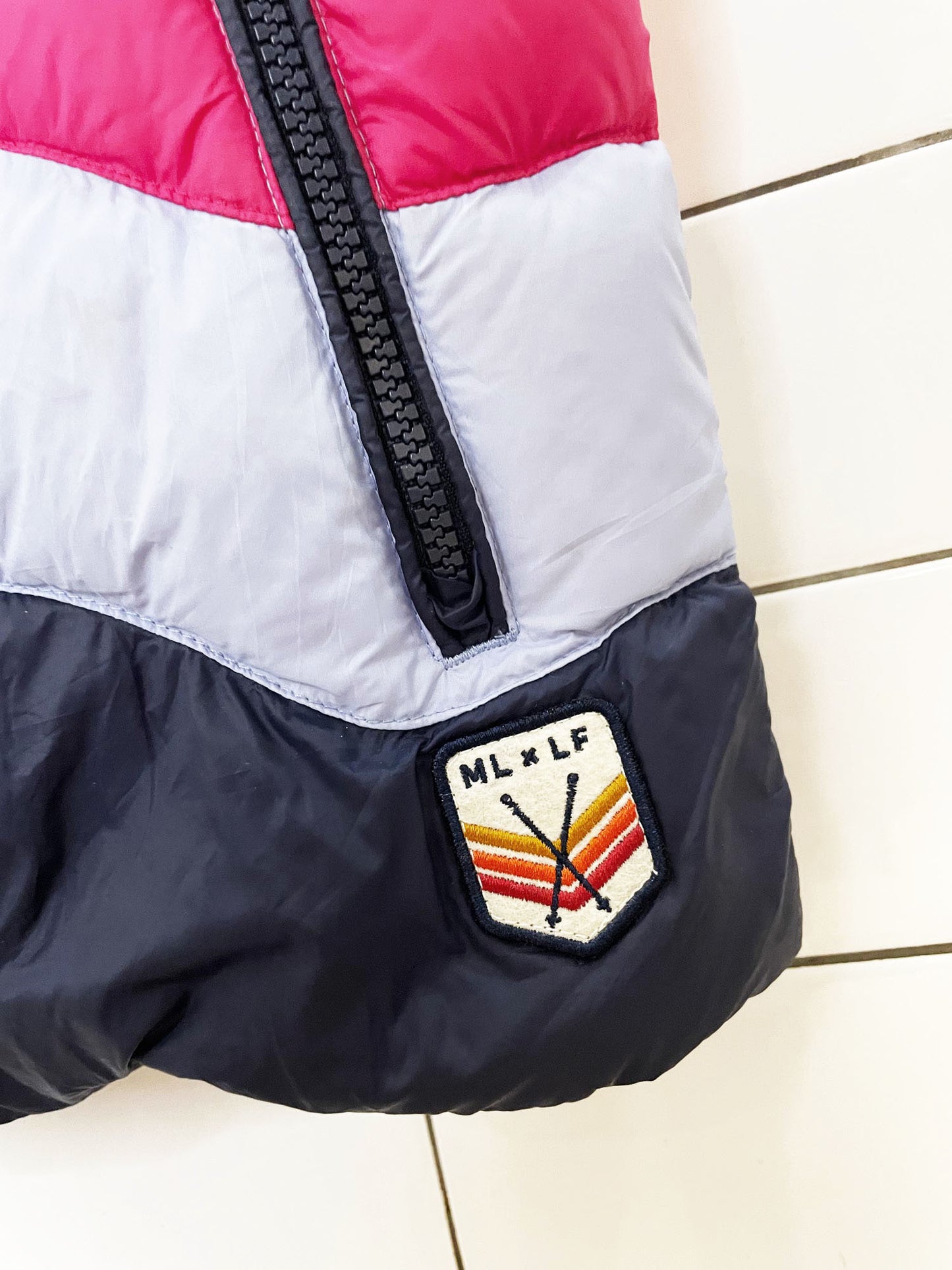 marine layer x lost & found aprés rainbow wave down feather puffer vest