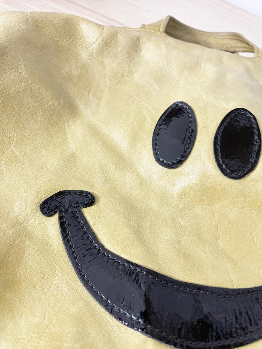 it's not me it's you london leather smiley backpack - good market thrift store