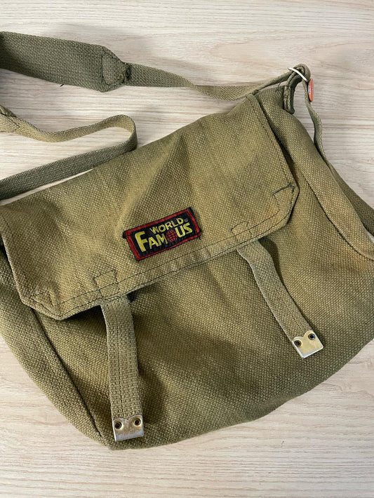 world famous faded messenger bag