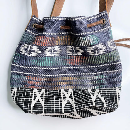 roots woven jute bucket bag with leather trim