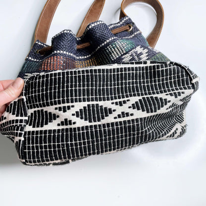 roots woven jute bucket bag with leather trim