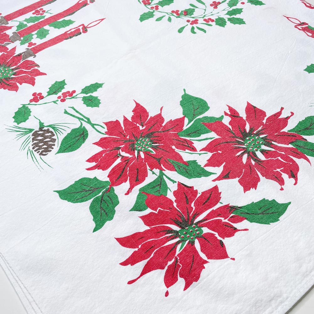 vintage candles and holly holiday table cloth