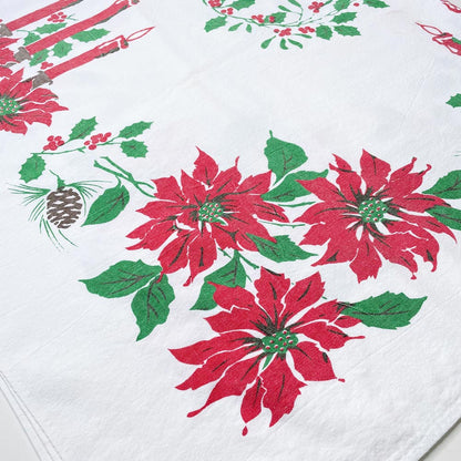 vintage candles and holly holiday table cloth