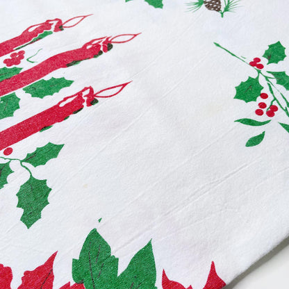 vintage candles and holly holiday table cloth