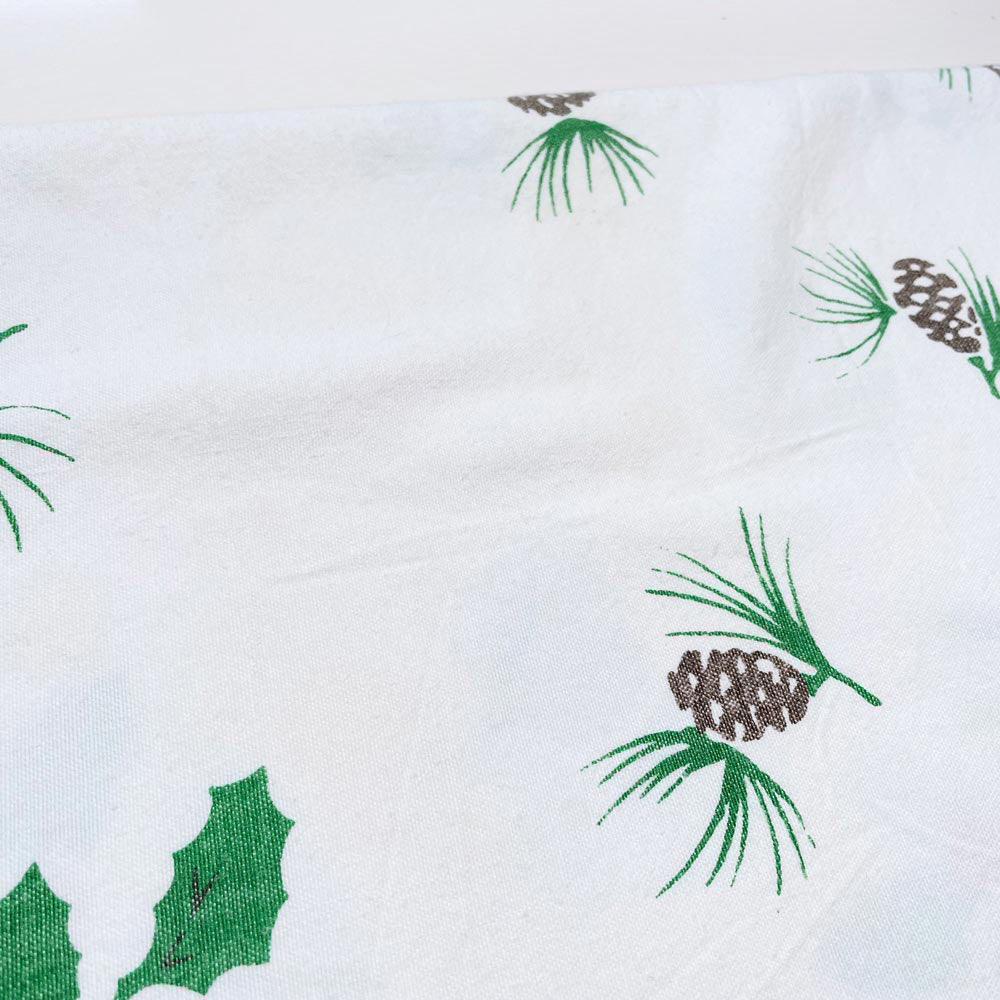 vintage candles and holly holiday table cloth