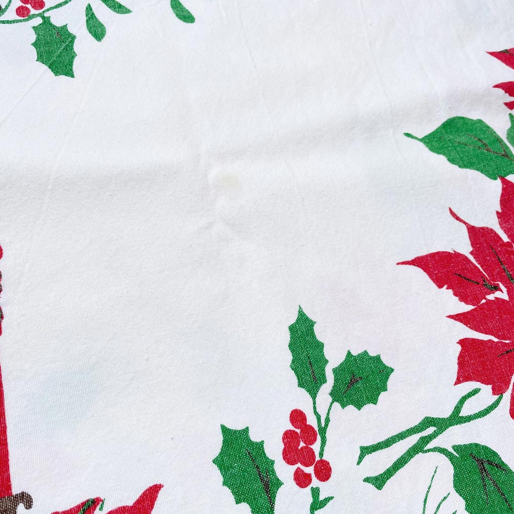 vintage candles and holly holiday table cloth