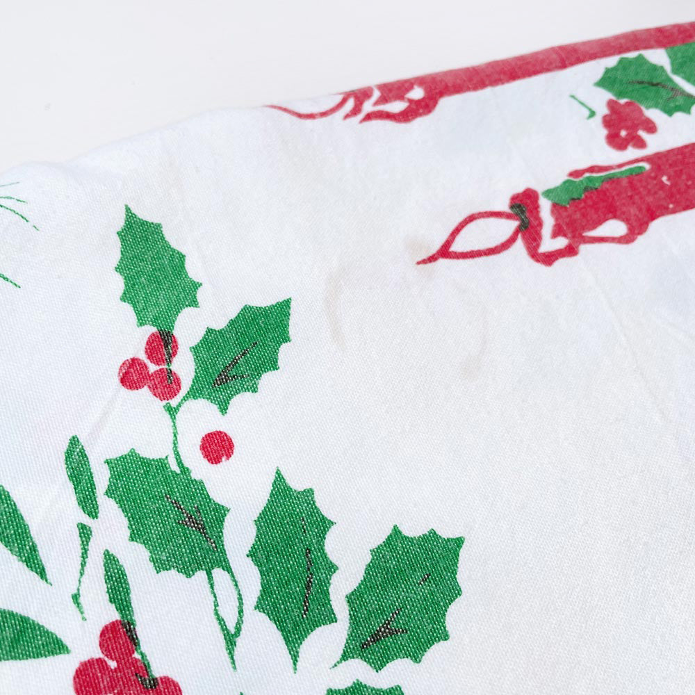 vintage candles and holly holiday table cloth