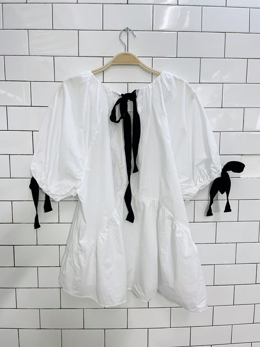 white puff sleeve peplum hem tie blouse
