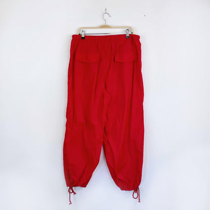 red nylon baggy parachute pants