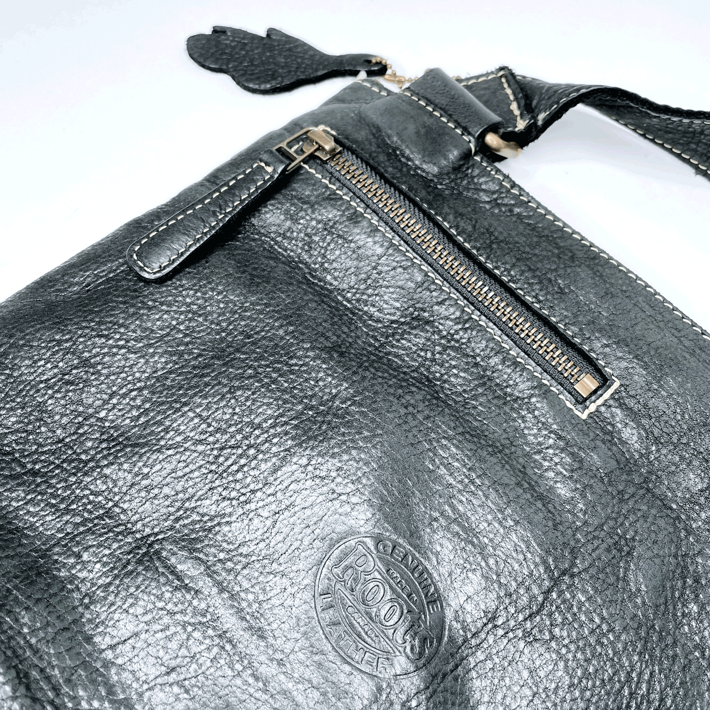 roots tribe crossbody pebbled leather bag