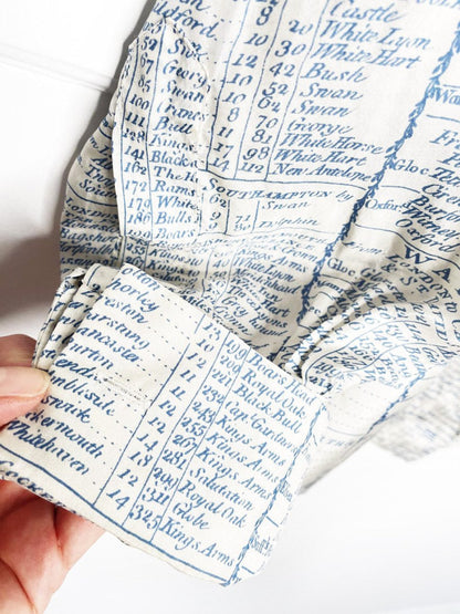 stella mccartney 100% silk french cuff english travel ledger print blouse - good market thrift store