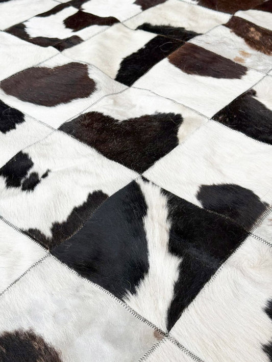 vintage hand - sewn cowhide patchwork rug - good market thrift store