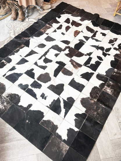 vintage hand - sewn cowhide patchwork rug - good market thrift store