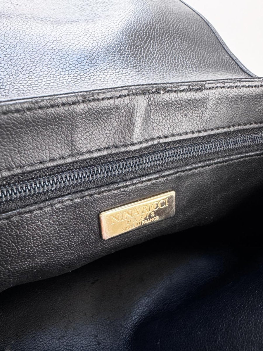 vintage nina ricci bow turn lock leather bag - good market thrift store
