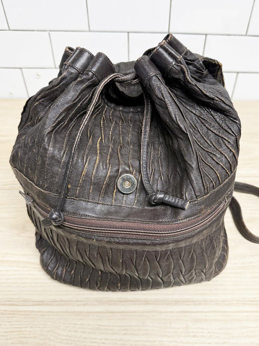 vintage textured drawstring leather backpack - good market thrift store
