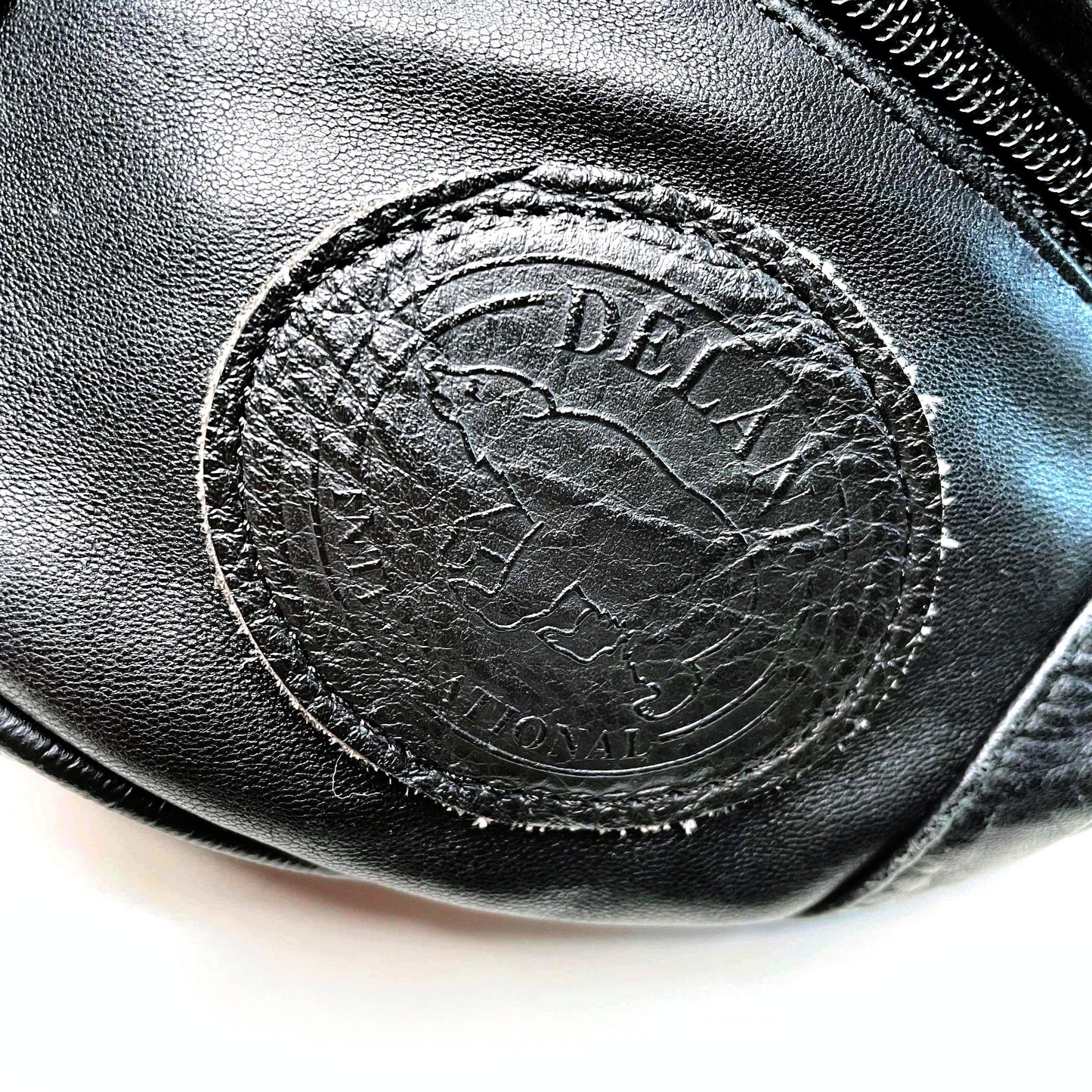 vintage black leather fanny pack with polar bear crest