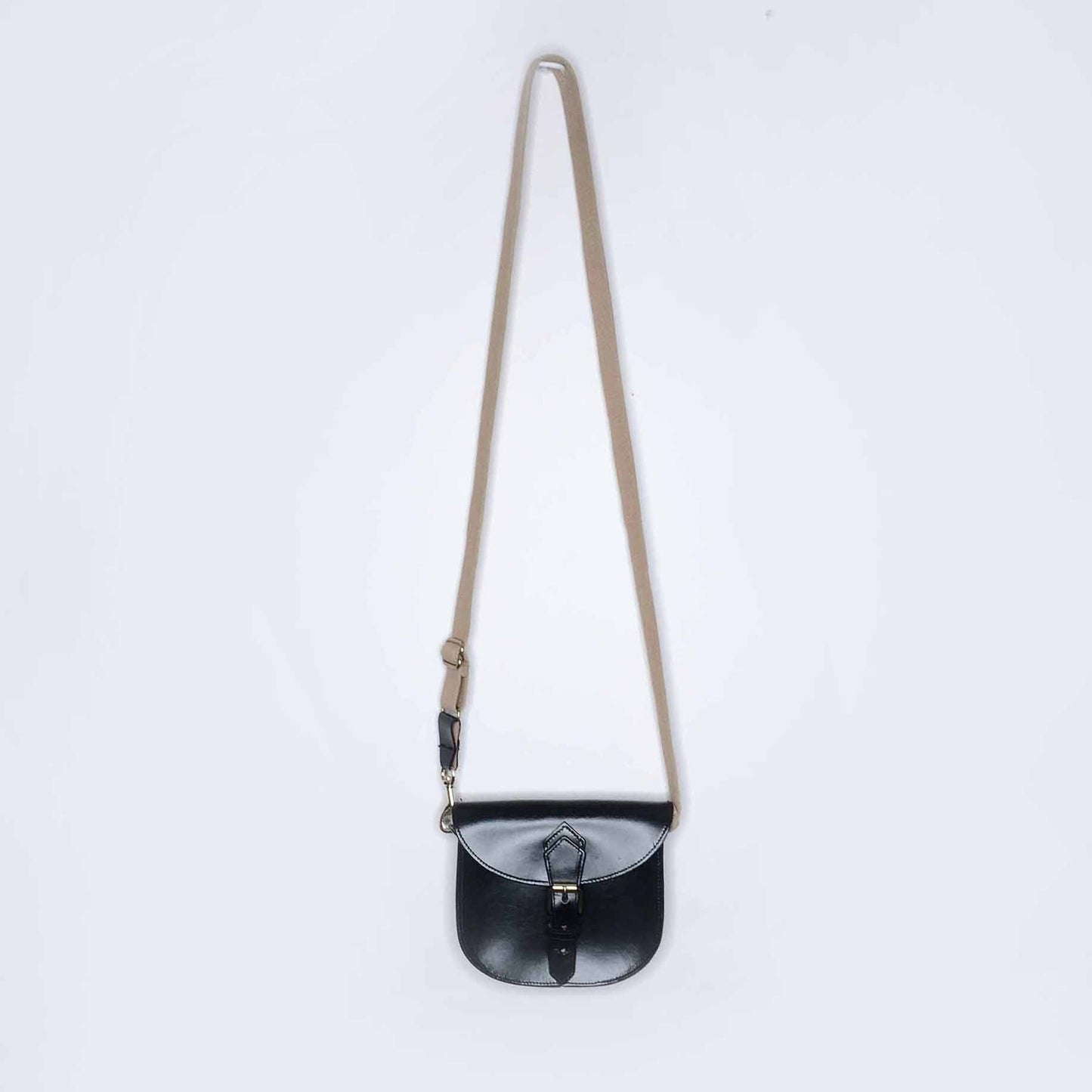 Mini leather saddle cross body bag with woven strap