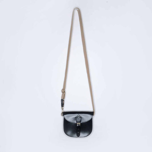 Mini leather saddle cross body bag with woven strap
