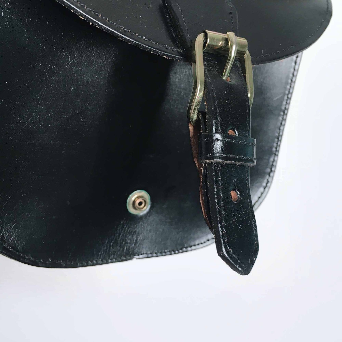 Mini leather saddle cross body bag with woven strap