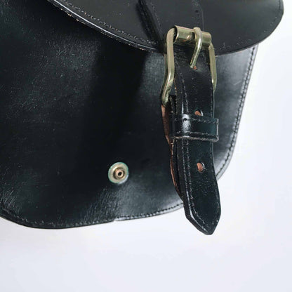 Mini leather saddle cross body bag with woven strap