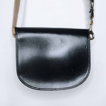 Mini leather saddle cross body bag with woven strap