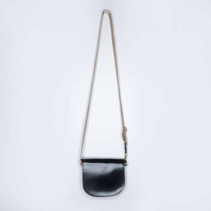 Mini leather saddle cross body bag with woven strap