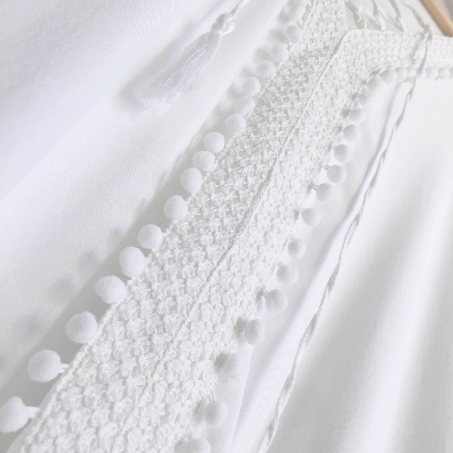 Bindya NY pom pom lace up tunic - size OS