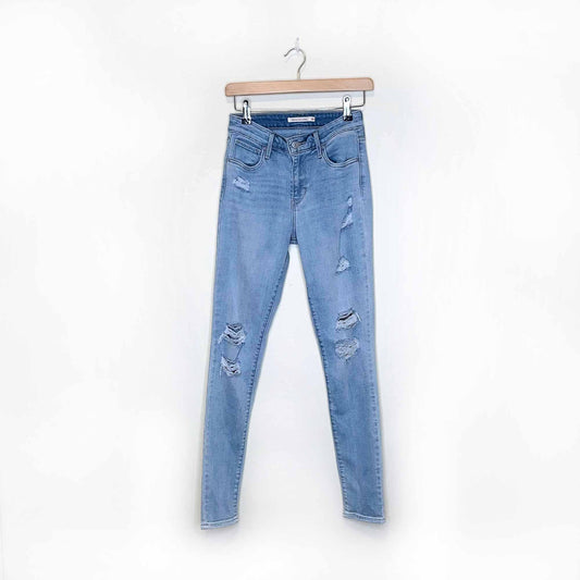 levi's 721 high rise light wash distressed skinny jeans - size 26