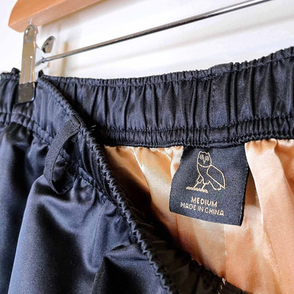 ovo october's very own satin tearaway track pants - size medium