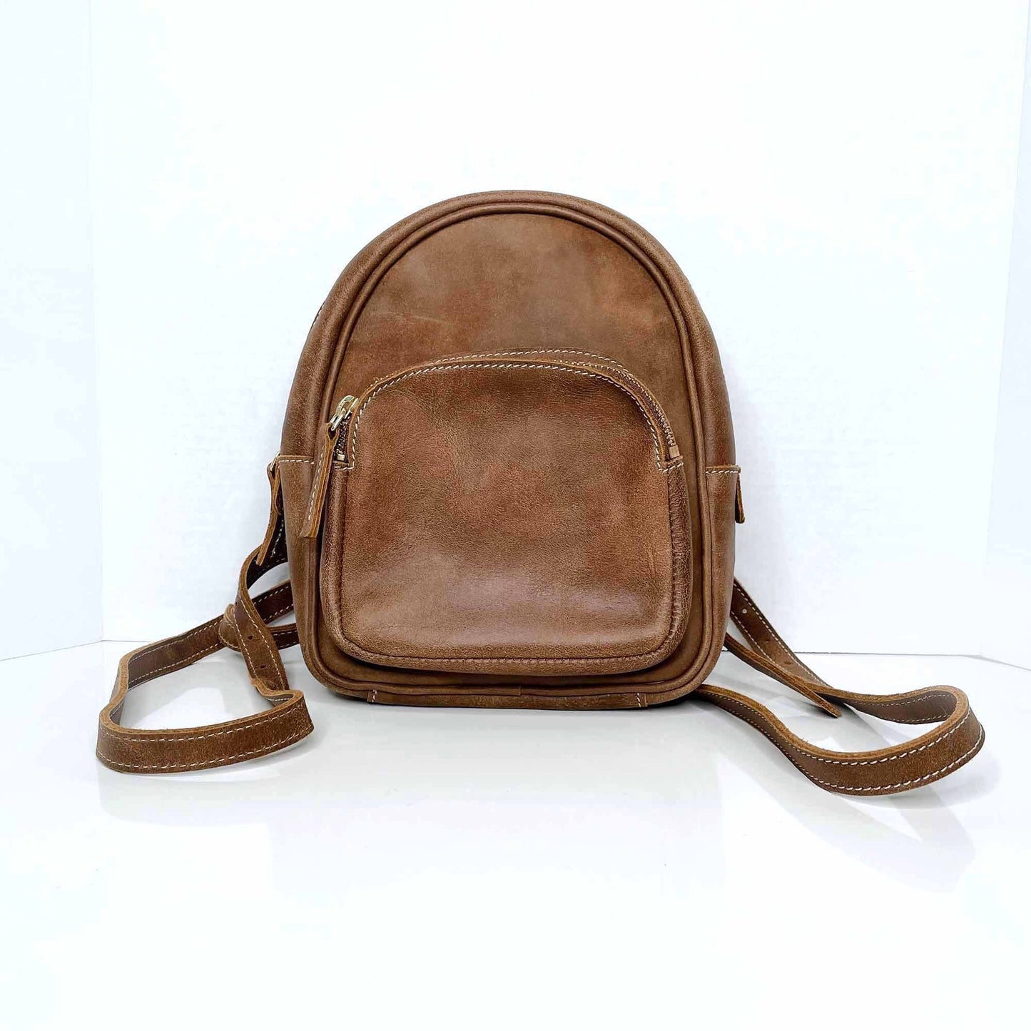 roots mini brown leather tribe backpack