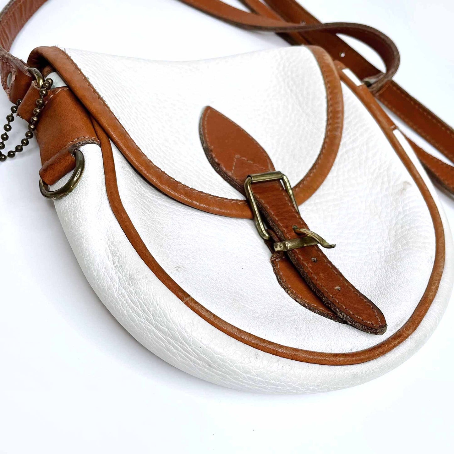 vintage roots white leather saddle crossbody with brown trim
