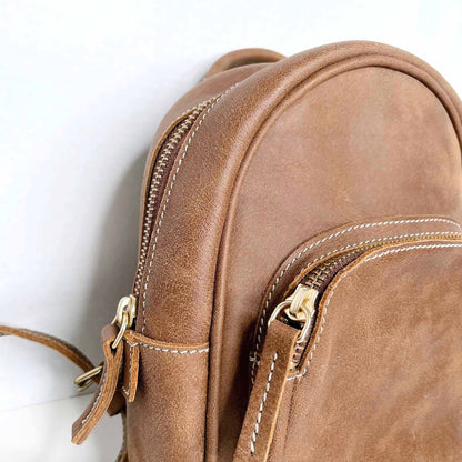 roots mini brown leather tribe backpack