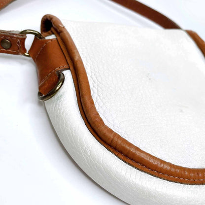 vintage roots white leather saddle crossbody with brown trim