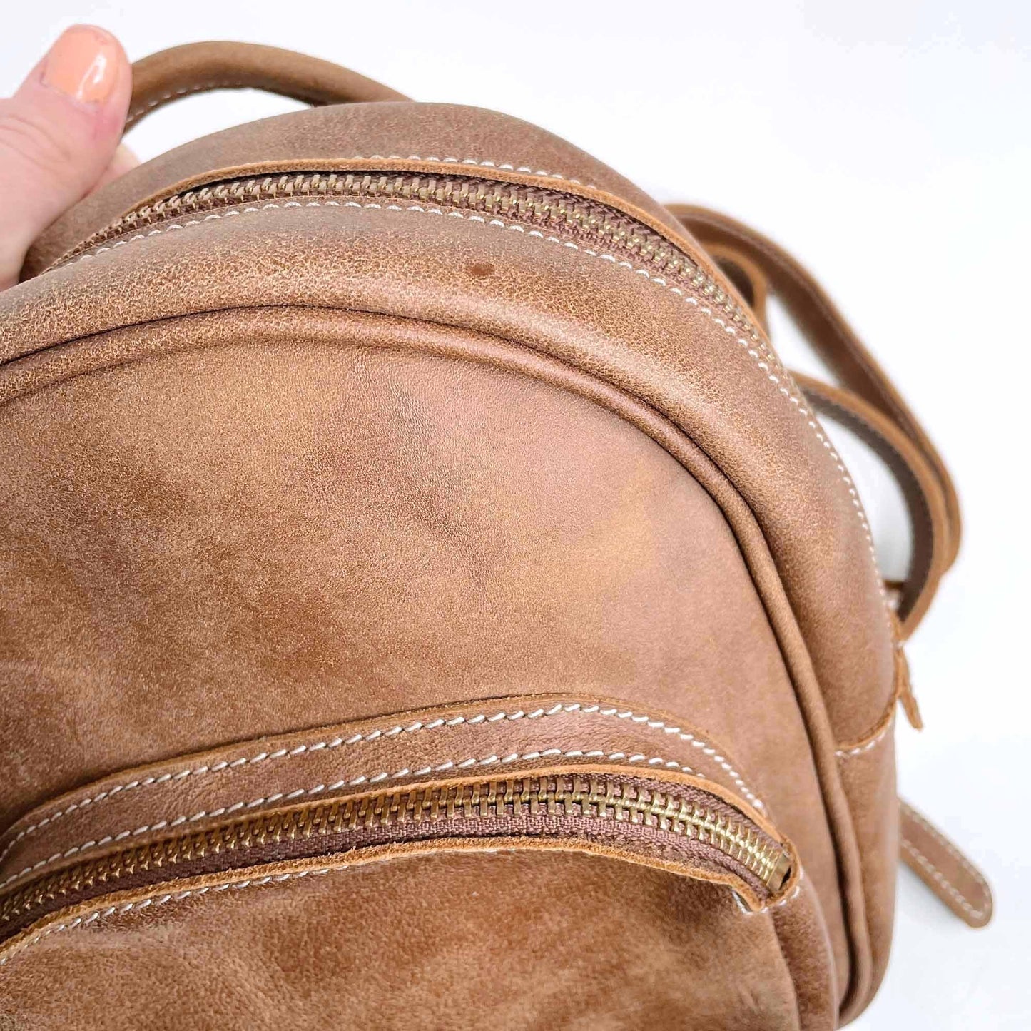 roots mini brown leather tribe backpack