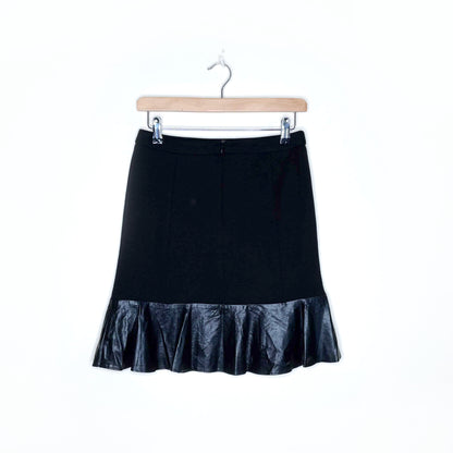 sandro black mini skirt with faux leather peplum hem - size 2